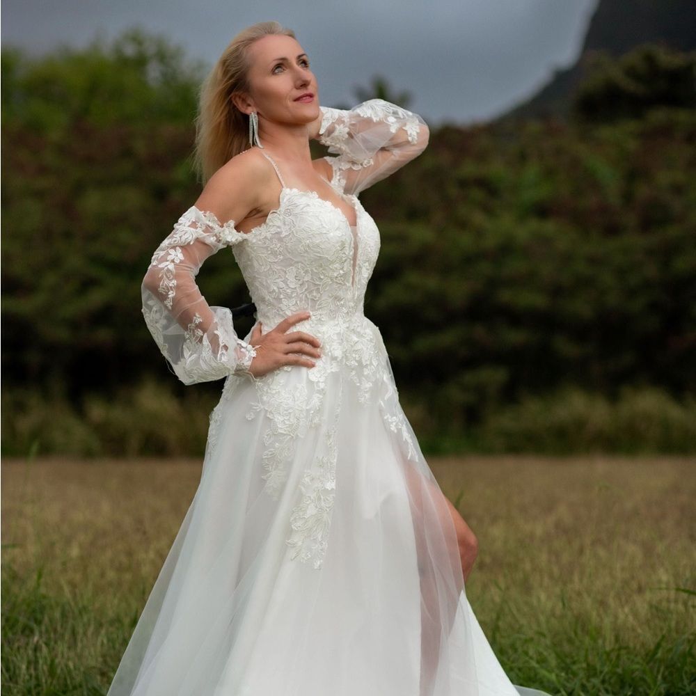 A-line wedding dress with straps and plunging neckline beaded lace